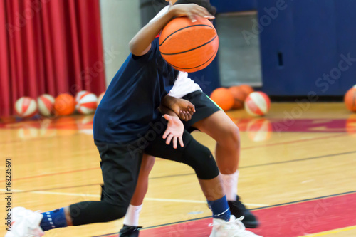 Dribbling a basketball at summer camp