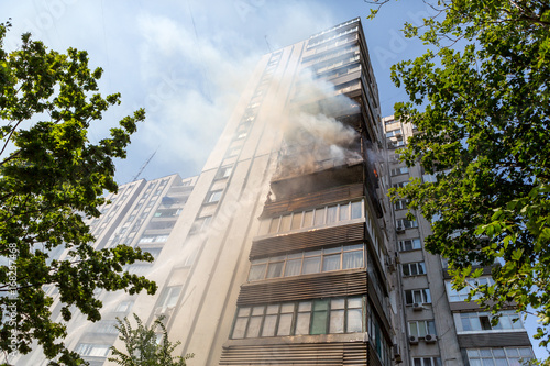 High-rise condominium or apartment burning. Fire in apartments of a large tenement-house.
