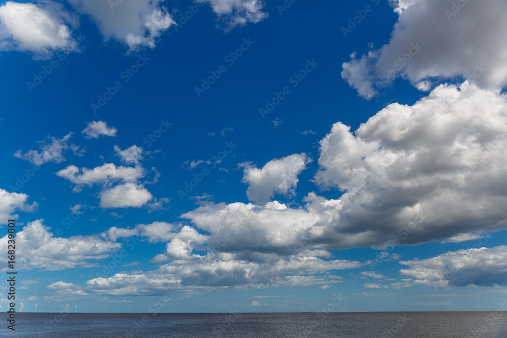 Lovely cluster of clouds in a sunny day over sea Lovely cluster of clouds in a sunny day over sea