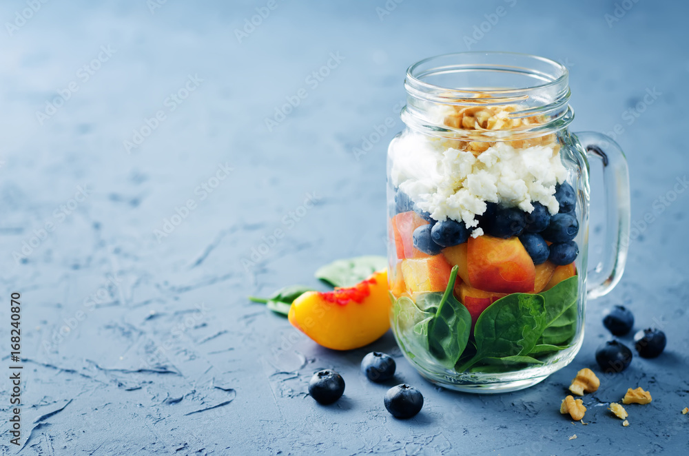 Spinach peach blueberry goat cheese walnuts salad in a jar Spinach peach blueberry goat cheese walnuts salad in a jar
