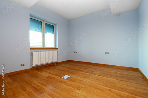 New empty room with light blue walls