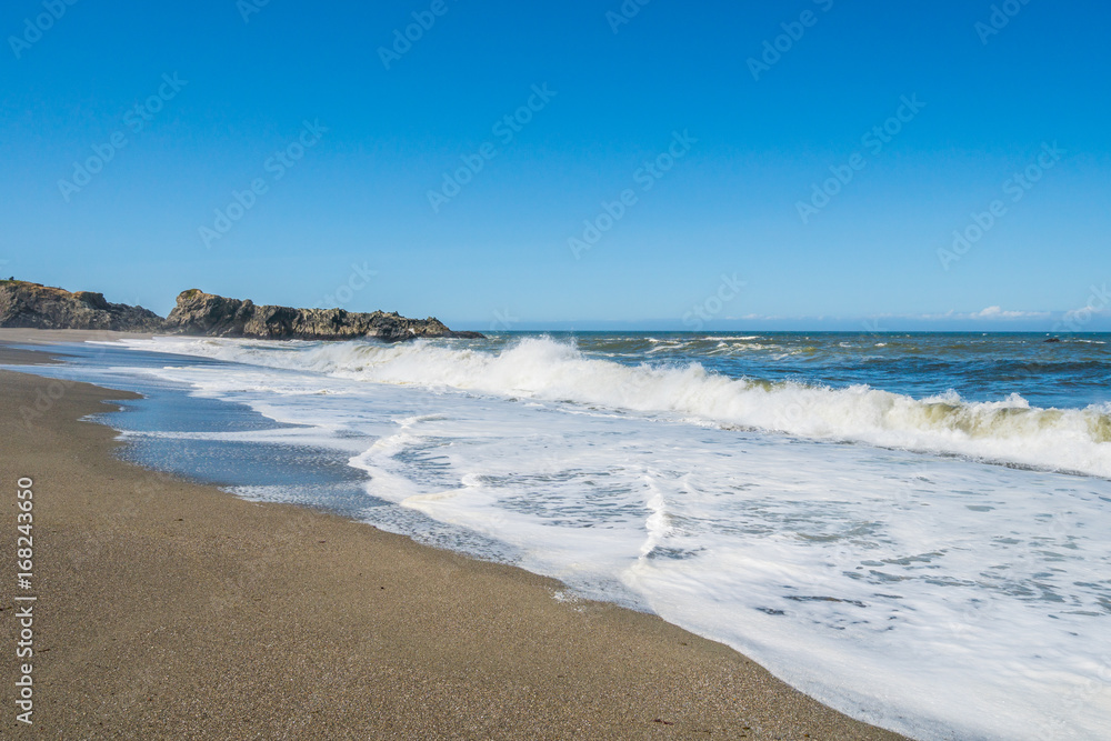 A huge sandy beach with large stones. Sonoma Coast State Park, California, USA