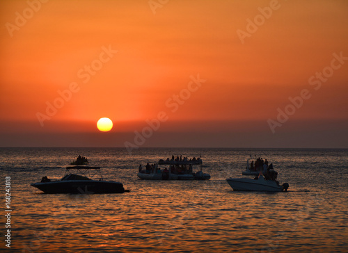 People watching sunset from boats © Studio Barcelona