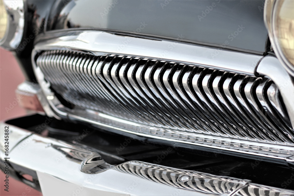 Frontal part with a grill of old black vintage car