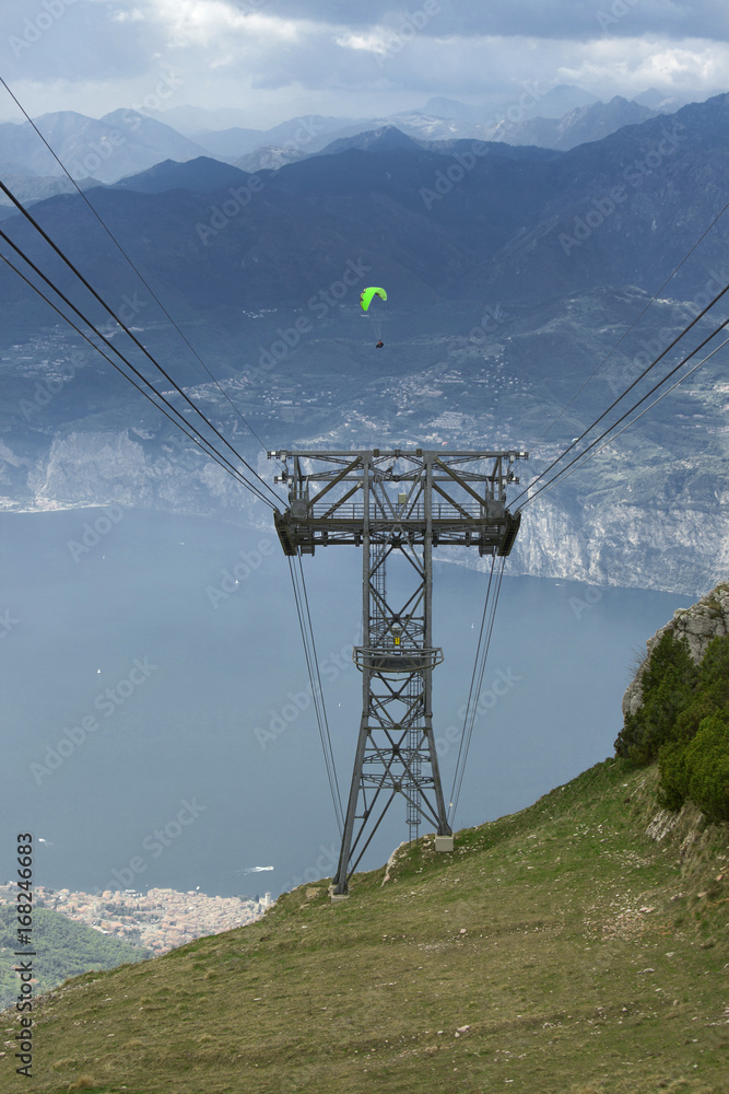 View from the Monte de Baldo mountain at Lago di Garda and a cableway