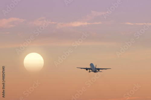 Airplane Taking Off and Sunset © pabloprat
