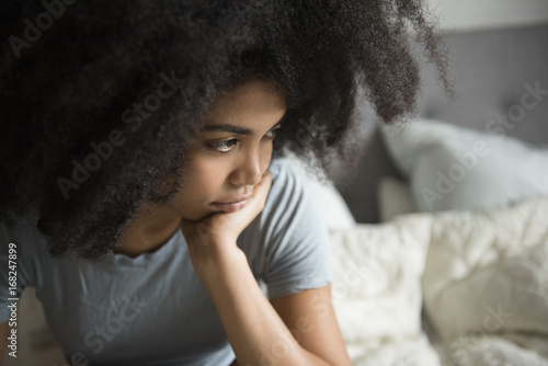 Woman sitting in bed photo