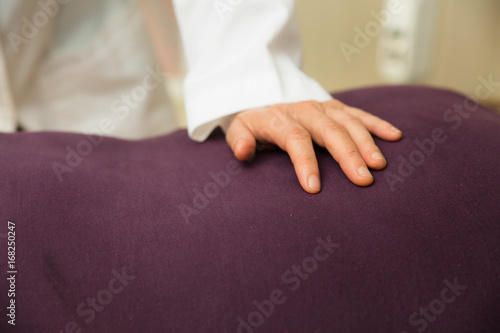 Elderly woman being massaged