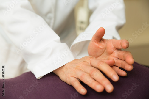 Fotografie Elderly woman being massaged