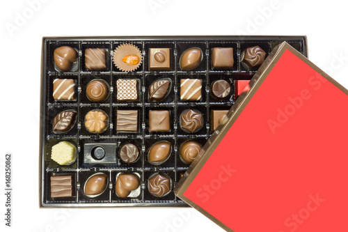 Box of delicious chocolates box with red lid isolated on white background. Clipping path