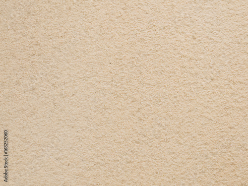 The wall of sand texture background.