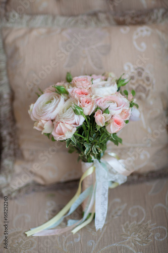 Elegant wedding flower bridal bouqet on texture sofa
