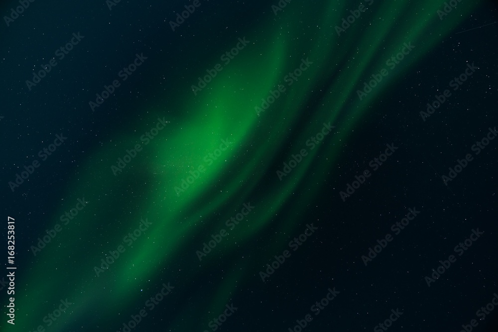 Obraz premium Abstract of green Northern Lights and starry sky