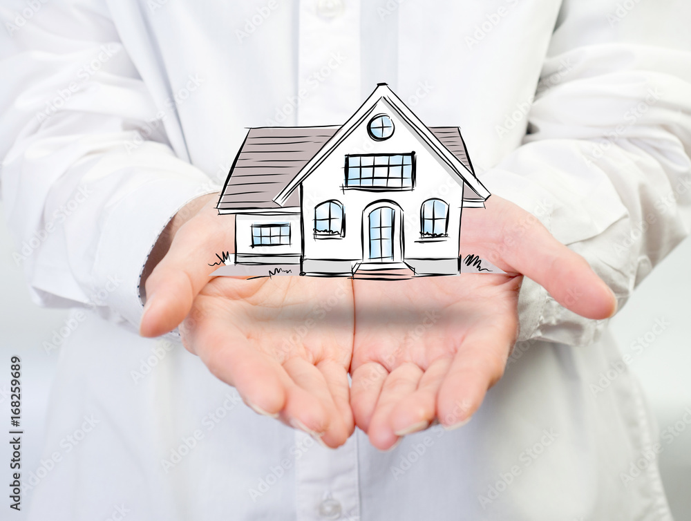 The Architecture, building, house,home,construction, real estate and property concept - close up of hands holding house or home model.Female hand holding house ,real estate agent. The Architecture, building, house,home,construction, real estate and property concept - close up of hands holding house or home model.Female hand holding house ,real estate agent.