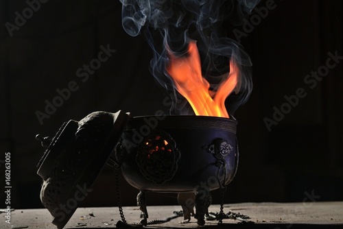 Burning myrrh incense in a Tibetan antique incense burner