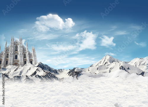 Milan Cathedral among the mountains with snow