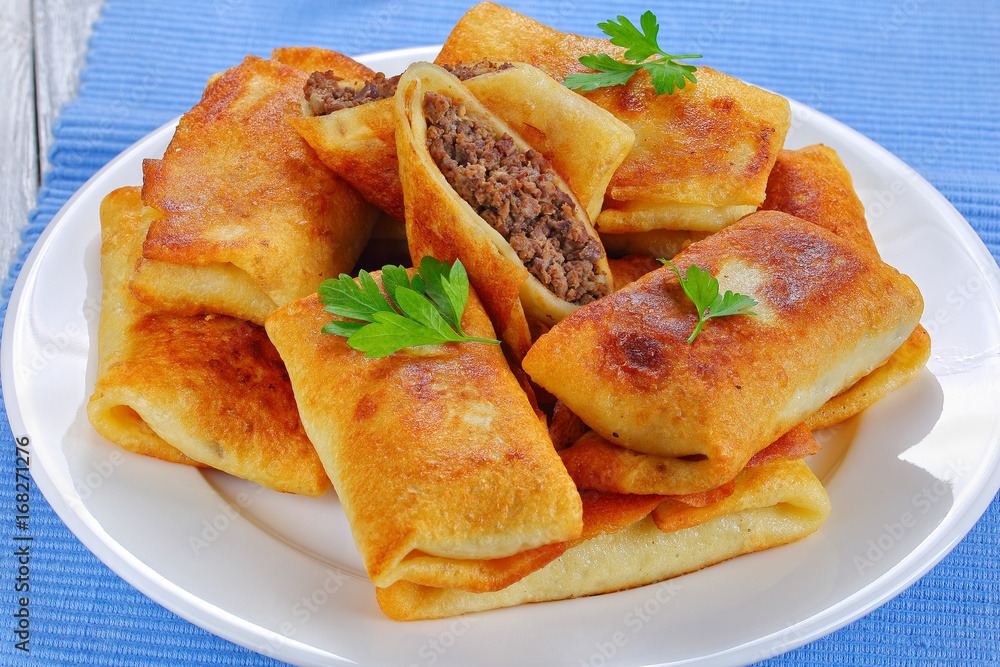 rolled up Crepes stuffed with minced liver rolled up Crepes stuffed with minced liver