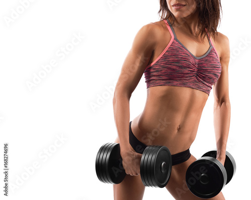Cropped studio shot of a female bodybuilder wearing sports top and shorts holding weights isolated on white copyspace gym fitness sporty lifestyle concept.