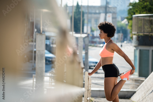 Slim athletic woman runner warm up outdoor © Martinan