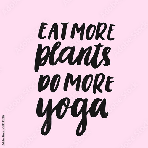Inspirational motivating inscription: Eat more plants do more yoga.  Hand written in black  ink on a pink background in a trendy brush lettering style.