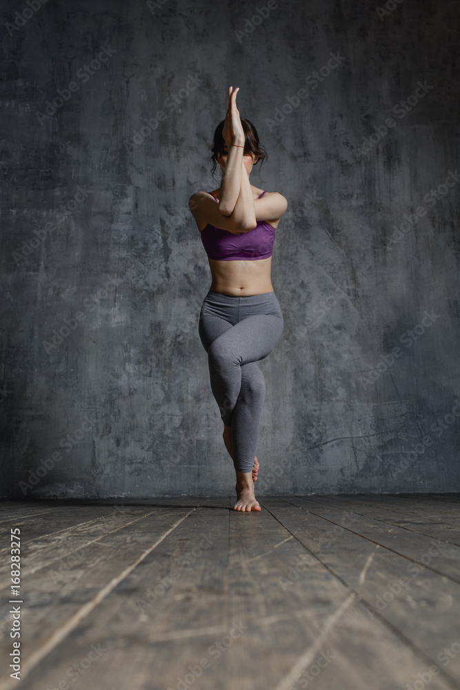 Young beautiful fitness female posing in studio Young beautiful fitness female posing in studio
