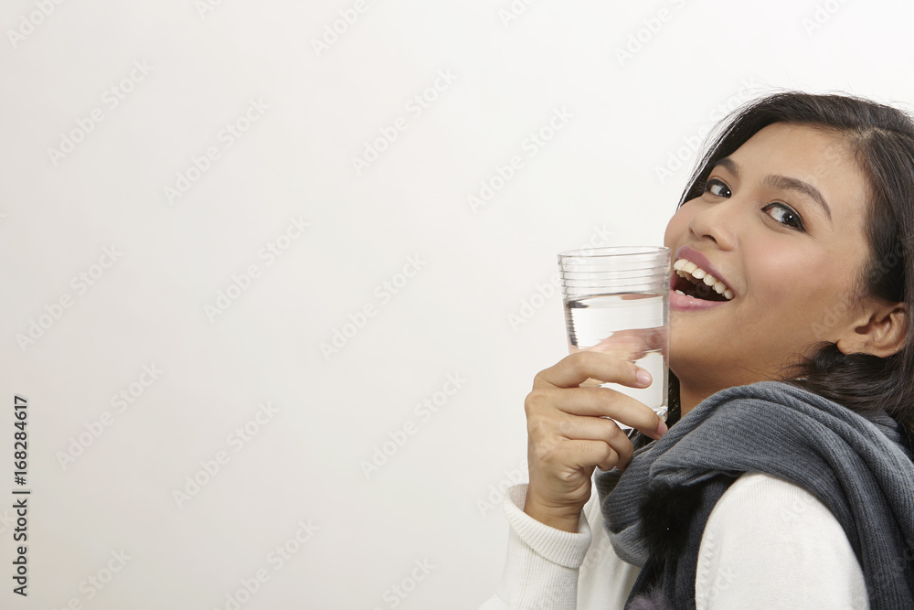 woman with glass of drinking water