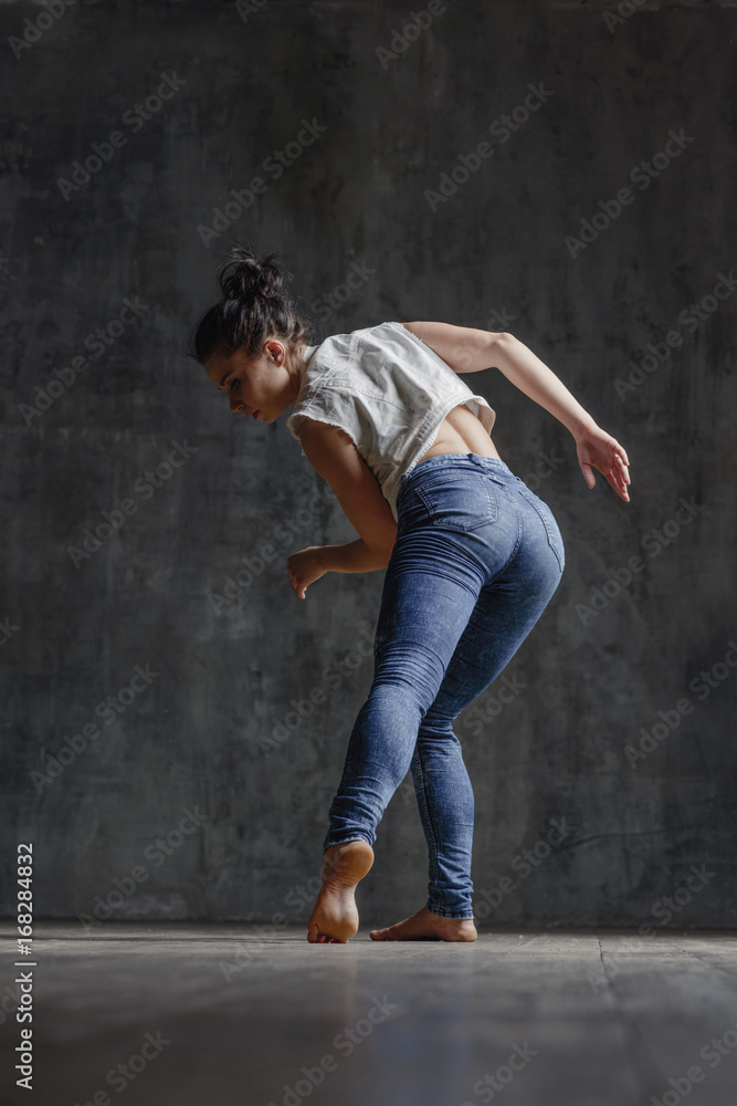 Young beautiful dancer is posing in studio Young beautiful dancer is posing in studio
