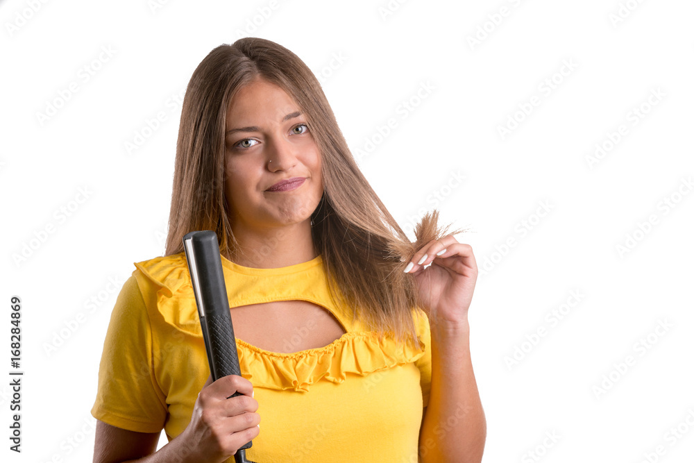 woman with a hair straightener woman with a hair straightener