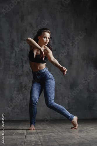 Young beautiful dancer is posing in studio © Alexander Y