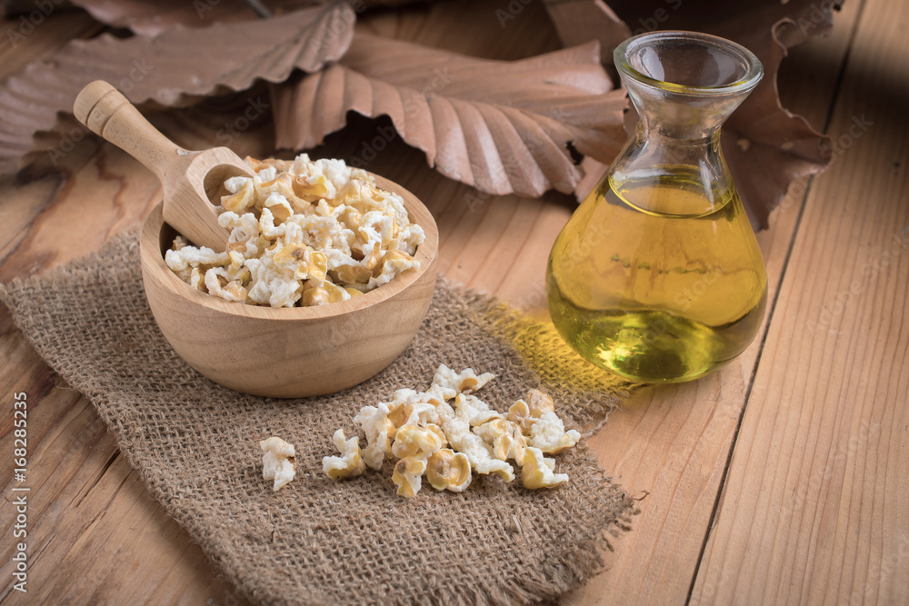 Prepared popcorn in bowl on kitchen table. Prepared popcorn in bowl on kitchen table.