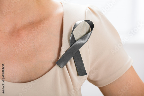 Woman With Grey Ribbon To Support Breast Cancer Cause