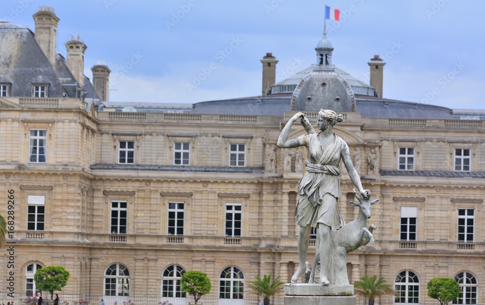 Fototapeta premium The senate and the statue in the garden of Luxembourg, Paris, France,