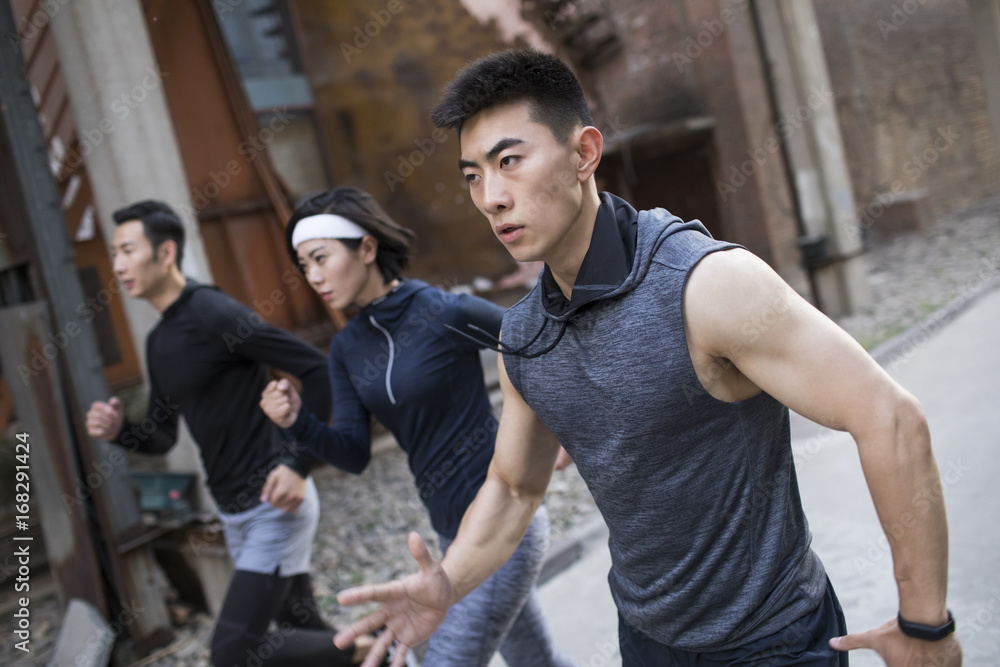 Young friends jogging outdoors Young friends jogging outdoors