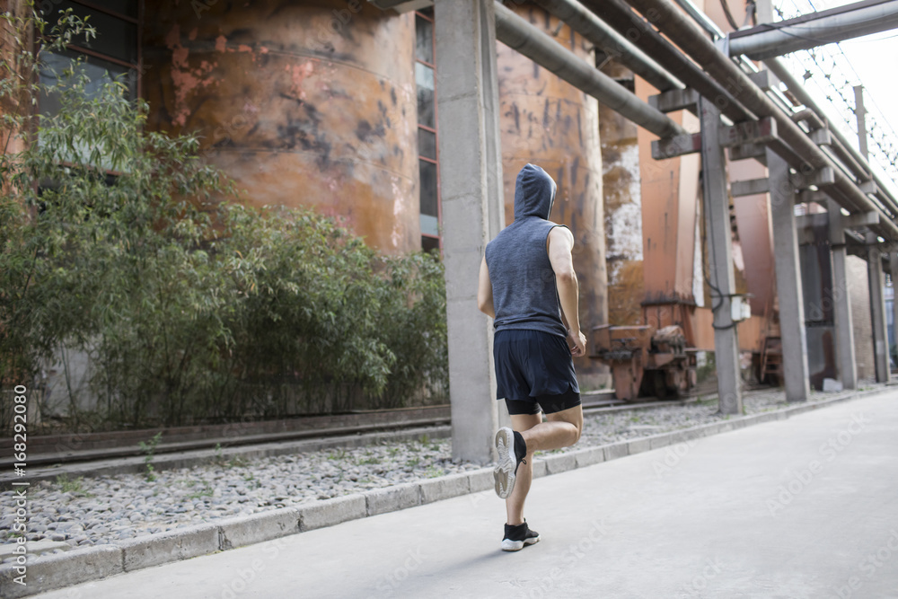 Young man jogging outdoors Young man jogging outdoors