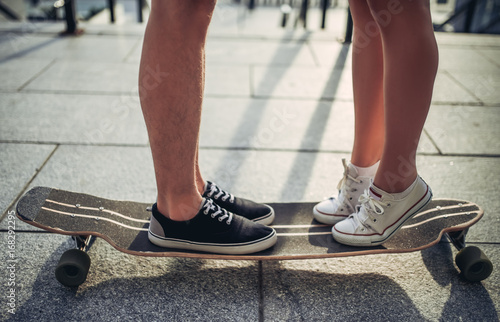 Couple with skateboard © Vasyl