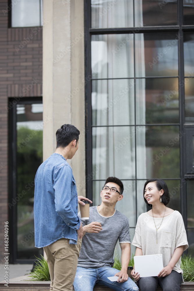Confident designer team talking outdoors Confident designer team talking outdoors