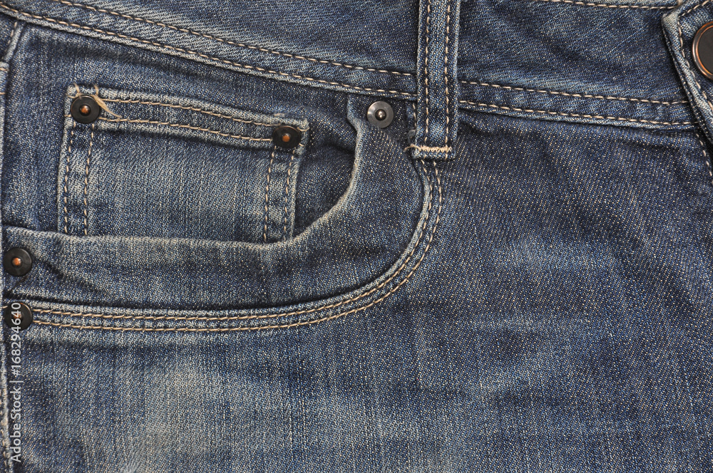Texture background of jeans, Blue jeans with a pocket detail Texture background of jeans, Blue jeans with a pocket detail