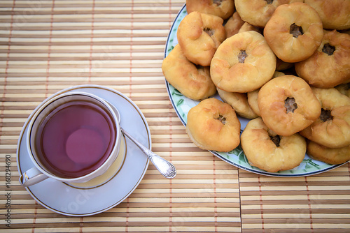 Tea and round cakes with meat, tatar peremyach photo