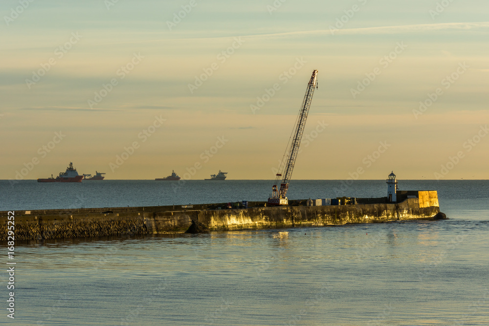 Aberdeen sea wall and crane.