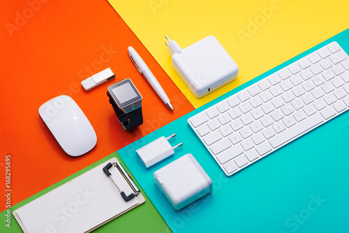Well organised white office objects on colorful background