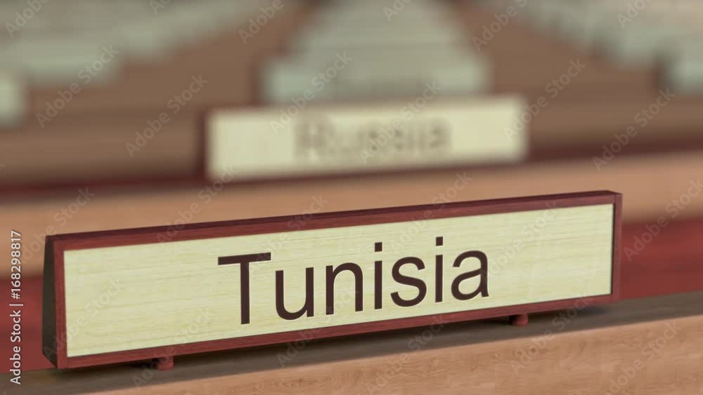 Tunisia name sign among different countries plaques at international organization. 3D rendering Tunisia name sign among different countries plaques at international organization. 3D rendering