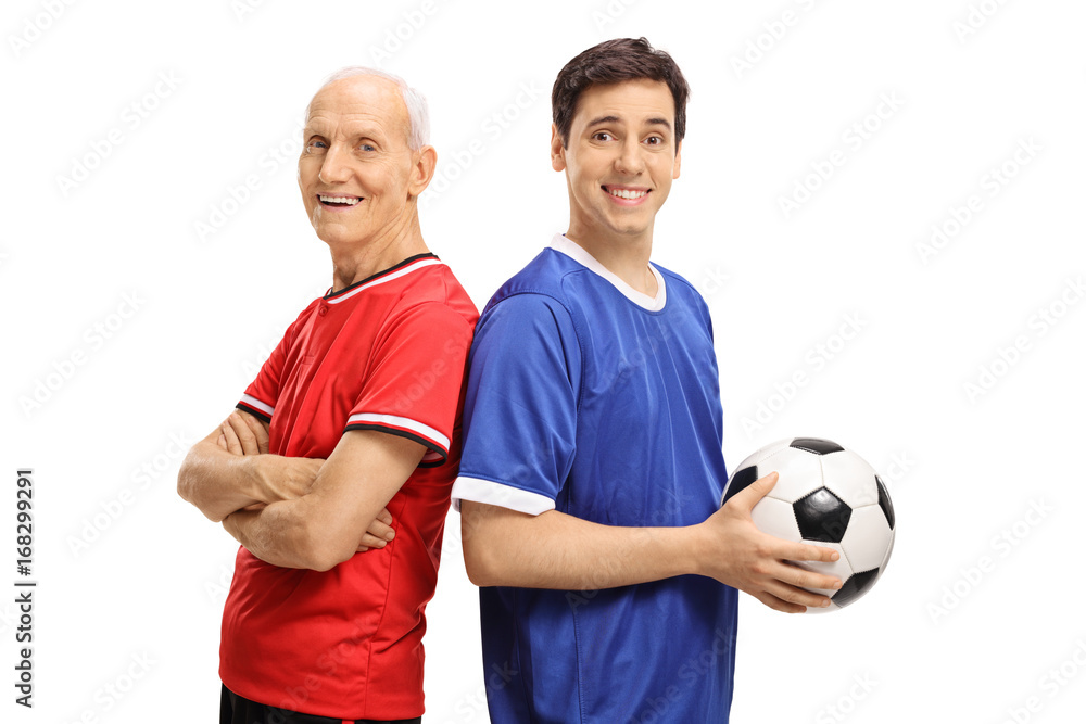 Elderly soccer player and a young player with a football