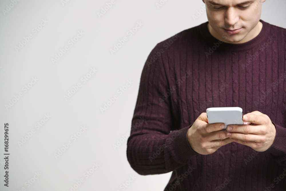 Close up portrait of a young white man using a smartphone Close up portrait of a young white man using a smartphone
