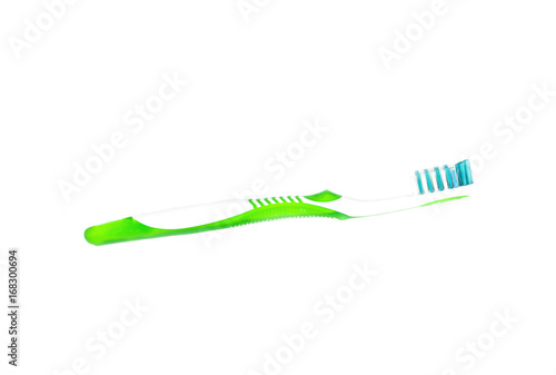 White and green plastic toothbrush