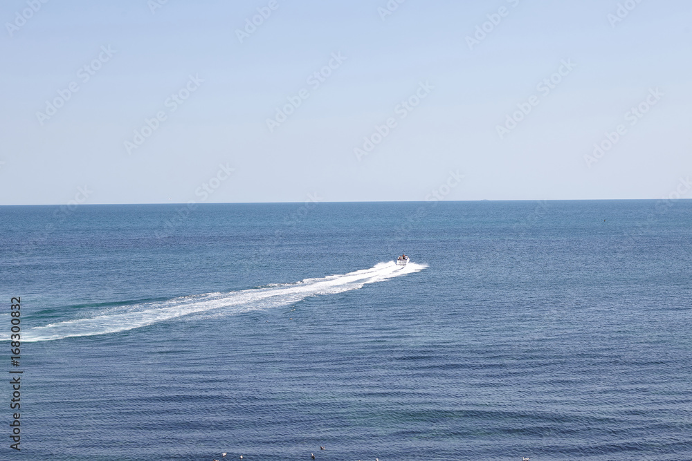 Naklejka premium Motorboat sailing on the black sea. 