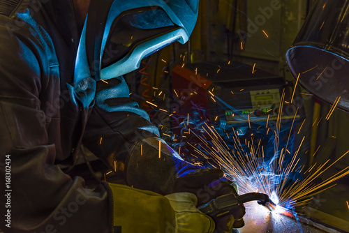 Industrial steel welder in factory