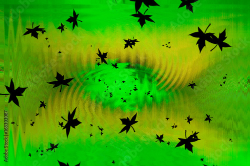 Maple leafs on green and yellow background © tommitt