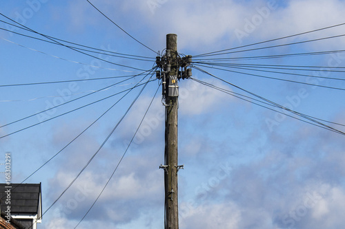 Telegraph pole with many cables