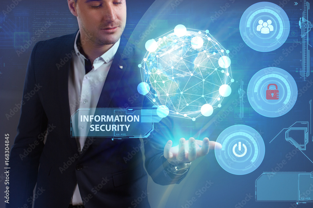 Business, Technology, Internet and network concept. Young businessman working on a virtual screen of the future and sees the inscription: Information security Business, Technology, Internet and network concept. Young businessman working on a virtual screen of the future and sees the inscription: Information security