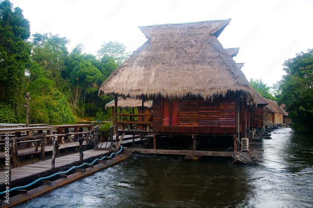 Wooden bungalows on the water on the river Kwai. Wooden bungalows on the water on the river Kwai.